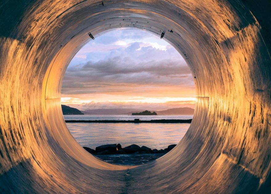 image of the sea at the end of a pipe